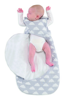 a baby laying on top of a cloud shaped sleeping bag with its arms in the air