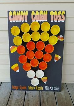 an orange and yellow candy corn toss game