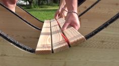 a man is working on some wood planks