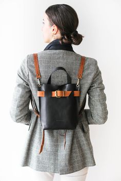 Mini leather Backpack, Black Leather Backpack, Backpack Purse, Leather Rucksack, Travel Backpack ✨Color Combinations you love ! Collection-Mini Backpacks. Combined Edition✨ Black with Brown I am super happy to announce your new line of mixed colored leather backpacks!🤩 The color combinations that are perfect for each other ! Now you can style your own belt and straps ! * Simple and Elegant design * Interior pocket with zipper * You can choose to add Back Pocket with Zipper * Button snap closing Black Leather Backpack For School, Leather Backpack As Gift, Black Bags With Leather Strap For On-the-go, Black On-the-go Bags With Leather Strap, Daily Use Leather Crossbody Backpack, Leather Strap Satchel Backpack For Daily Use, Crossbody Leather Backpack For Travel, Backpack With Removable Pouch As Gift, Leather Tote Backpack For School