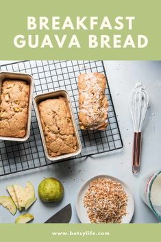 three loafs of bread sitting on top of a cooling rack next to an apple