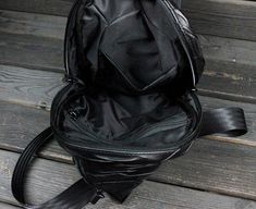 Handmade biker's black leather backpack Skulls in gothic style for men and women. Another piece from our author's collection of Leather Captivity. This bag is suitable for everyone who are not afraid to show their individuality. Strong and functional, high-quality accessories. Withstands any weather. Comfortable in using. Black Leather Gothic Bags, Biker Style Leather Travel Bag, Black Gothic Leather Shoulder Bag, Gothic Leather Shoulder Bag For Travel, Gothic Leather Shoulder Bag With Zipper Closure, Alternative Style Leather Shoulder Bag With Zipper, Alternative Black Travel Bag, Alternative Style Black Travel Bag, Alternative Leather Bag With Zipper Closure