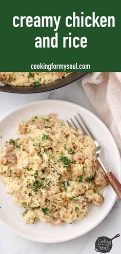 creamy chicken and rice on a white plate with a fork