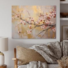 a living room filled with furniture and a painting on the wall