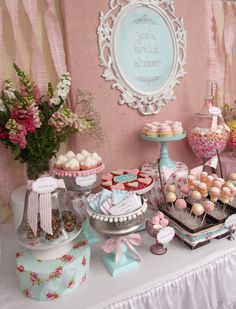 a table topped with lots of desserts and candies