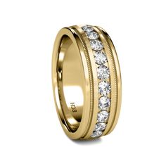 a yellow gold wedding ring with rows of diamonds on the side and inlays