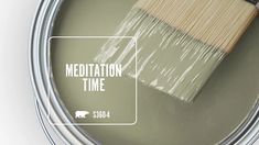 a paint can with a brush in it and the words meditation time painted on it