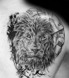 a lion tattoo on the back of a woman's shoulder