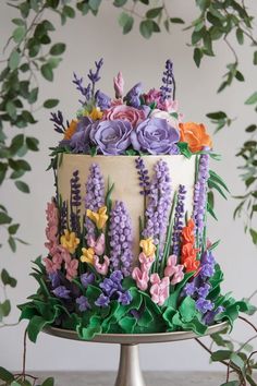 Wildflower-Inspired Cake with Hand-Piped Buttercream Blooms Piped Wildflower Cake, Cakes With Flowers On Top, Wildflower Cake Ideas, Birthday Cake Aesthetic Purple, Cakes With Real Flowers, Purple Birthday Cake Ideas, Fairytale Cake, Purple Birthday Cake, Wildflower Cake