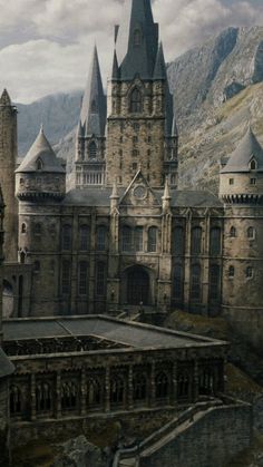 an image of a castle with mountains in the background