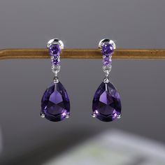 925 Sterling Silver Purple Elegant Water Drop Earrings Material : 925 Sterling Silver + Purple Cubic Zirconia Measurements : Studs Measure 2 Cm Shape : Drop Earrings Weight: 0.10 Oz Most Merchandise Ships Within 2 Days All Items Come Packaged In A Small Jewelry Box Which Is For When Buying As A Gift. Dark Purple Accessories, Purple Drop Earrings, White Diamond Earrings, Dangle Earrings Wedding, Purple Necklace, Teardrop Dangle Earrings, Purple Earrings, Trendy Earrings, Amethyst Earrings