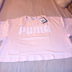 Light Pink, Cropped Puma Tshirt. Never Been Worn, Tags Still Attached, Size Large White Puma Logo Top For Streetwear, Puma Graphic Tee With Crew Neck, Puma Logo Graphic Tee With Crew Neck, Puma Logo Cotton Short Sleeve Top, Short Sleeve Cotton Top With Puma Logo, Cotton Short Sleeve Tops With Puma Logo, Cotton Puma Logo Top For Streetwear, Puma Logo Cotton Top For Streetwear, Puma Graphic Tee With Short Sleeves