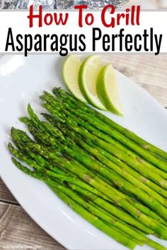 how to grill asparagus perfectly on a white plate with lemon wedges and lime