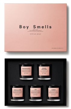 three candles in a box with the words boy smells on it