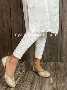 Comfortable and stretchable cotton ankle length pants with Lucknow Chikankari. This beautiful hand embroidered pants can be worn on any kurtis/ tunics. Cool and comfy ! Length:37.5 inches apprx  Inseam- 26 inches apprx  Embroidery designs vary. Ankle Length Pants With Kurti, Traditional Cotton Ankle-length Kurta, Traditional Ankle-length Cotton Kurta, Cotton Pants With Chikankari Embroidery For Eid, Cotton Bottoms With Chikankari Embroidery For Diwali, Ankle-length Cotton Kurta With Zari Work, Festive Cotton Bottoms With Chikankari Embroidery, Fitted Straight Pants With Chikankari Embroidery, Fitted White Pants With Chikankari Embroidery