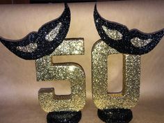 the number fifty five is decorated with glitter