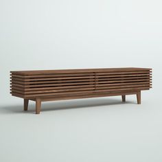 a wooden bench sitting on top of a white floor