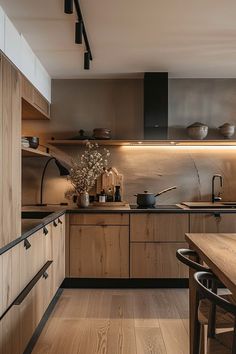 a kitchen with wooden cabinets and black appliances