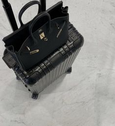 Trip Bags Aesthetic, Black Luggage Aesthetic, Hermes Birkin Aesthetic, Rimowa Aesthetic, Hermes Bag Aesthetic, Travel Bags Aesthetic, Travel Luggage Aesthetic, Black Bag Aesthetic, Hermes Bags Birkin