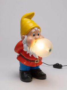 a gnome with a light in his hand