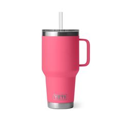 a pink yeti cup with a straw in it