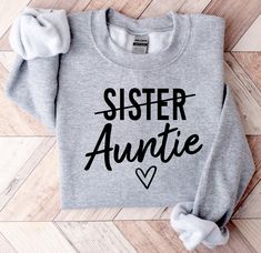 "Auntie Shirt, Gift For Auntie, Mother's Day Gift,Aunt Gift,Aunt Shirt,Gift for Sister, Pregnancy Announcement Shirt,Auntie Squad Shirt ----- About Us ----- All TeaShirtUS shirts use the highest quality material for ultra-soft and comfortable wear. Most importantly all of our shirts are printed using the most advanced apparel printer to ensure vibrant colors and detailed graphics. ----- How To Order ----- 1-) Please, check and review all the photos. 2-) Choose your t-shirt size and color. *Different styles of shirts may have different shades of same color choice due to different manufacturer brands. *For this reason, we recommend you to match shirts from the same styles if you want precisely matching colors (ex. Unisex, V-necks, Toddler, etc.). 3-) Click add to cart. You can go back to add Auntie Again Announcement, Auntie Outfits, Aunt Stuff, Aunt Tshirt, Sister Pregnancy Announcement, Gifts For Aunts, Auntie Era, Aunt Shirt, Aunt Life