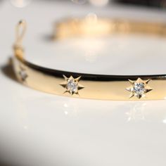 ♡14K solid gold stars bangle bracelet -100% Handmade -Solid 14K Gold -diamonds/C.Z (OPTION) ♡ Product details -Material: 14K solid gold (Yellow gold,Rose gold,White gold) -Total weight :app.14.37g (17.5CM) ♡Natural Diamonds -Size:app.1.8mm x14pcs -Carats:app. 0.336ct. -Color:F-H -Clarity:SI1-2 ♡Size -bracelet size= wrist size + 1cm (ex. my wrist size 15cm = bracelet size 16cm) (if you want big stars, we recommend cubics(but basic size is 1.8mm)) ♡Depending on the size the bangle, the size of dia Luxury Star-shaped Jewelry With Diamond Accents, Fine Jewelry Single Diamond Bangle, Celestial Diamond Jewelry With Single Diamond, Adjustable Diamond Bangle Fine Jewelry, 14k Gold Bangle With Vvs Clarity, Adjustable Diamond Bangle In Fine Jewelry, Star-shaped Diamond Jewelry With Polished Finish, Luxury Star-shaped Jewelry With Single Cut Diamonds, Elegant Star Jewelry With Vvs Clarity