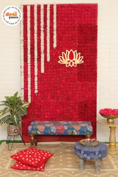 a room decorated with red flowers and decorations