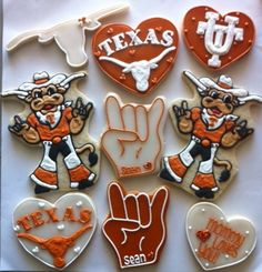 texas university decorated cookies are arranged in the shape of heart, hand, and cow