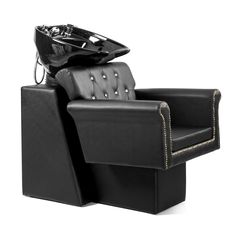 a black chair with a helmet on it's back and foot rest in the middle