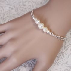 Bridesmaids Swarovski Ivory Pearl Chain Bracelet  PEARLS AVAILABLE IN OTHER COLORS. Please see last photo and kindly note on check-out your color preference.  OPTIONS: Sterling Silver Gold Plated Silver Plated  ADD-ON INITIAL CHARMS ALSO AVAILABLE FOR SEPARATE PURCHASE: Gold Bridesmaid Necklace, Bridesmaid Pearl Bracelet, Turquoise Bridesmaid, Silver Infinity Bracelets, Pearl Bracelet Wedding, Maid Of Honor Gift, White Pearl Bracelet, Bridesmaid Pearls, Etsy Bridesmaid Gifts