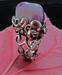 this ring is inspire by the Baroque period, undulating lines and extravagant details, unknown stone from Colombia. this piece is for someone unconventional and love Beauty. Purple Gemstone Fusion Rings, Mystical Sterling Silver Rings In Purple, Unique Purple Amethyst Ring, Mystical Sterling Silver Purple Rings, Mystical Purple Sterling Silver Rings, Purple Sterling Silver Fusion Jewelry, Baroque Period, Spiritual Transformation, Ring Gemstone