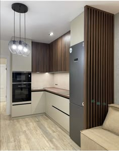 a modern kitchen with wood paneling and stainless steel appliances