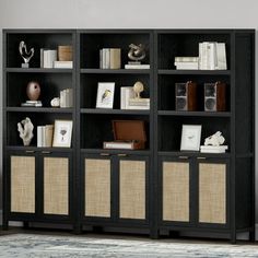 a black bookcase filled with lots of books