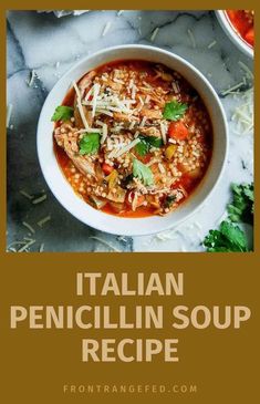 a bowl of italian chicken soup with parmesan cheese and cilantro on the side