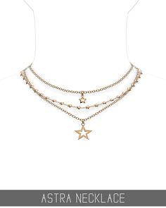 a necklace with three stars hanging from it's sides and the words astro necklace written on