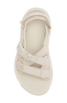 This rugged sandal breaks the mold with buckled cross straps, extra cushioning and a mesh lining for optimal comfort in the sun. The quick-dry webbing is made from recycled plastic, saving five plastic bottles from ending up in the landfill. EVA-cushioned footbed with arch support Antimicrobial fabric engineered to inhibit the growth of odor-causing germs REPREVE® recycled polyester upper/textile lining/rubber sole REPREVE recycled polyester is made from 100% post-consumer recycled plastic bottl Comfortable White Sport Sandals For Outdoor Activities, Functional White Sport Sandals For Outdoor, White Functional Outdoor Sandals, Lightweight White Sport Sandals For Outdoor, Outdoor White Sport Sandals With Arch Support, Functional White Open Toe Sport Sandals, White Sandals With Arch Support For Outdoor, Synthetic Sport Sandals With Adjustable Strap For Outdoor Activities, Synthetic Sport Sandals With Adjustable Strap For Outdoor