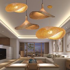 a living room filled with furniture and lots of lights hanging from the ceiling above it