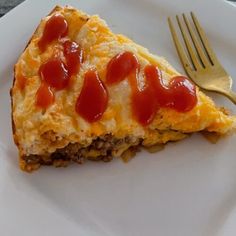 a piece of pizza on a plate with a fork