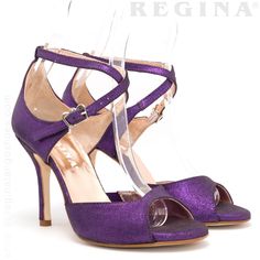 Introducing the Buenos Aires Shimmery Purple Tango Shoes, a stunning addition to any dancer's wardrobe. These high-heeled dance shoes are crafted with a dazzling shimmery purple finish, designed to turn heads and elevate your performance. The blend of elegance and functionality makes these shoes ideal for any dance event, from a glamorous tango performance to a stylish bridal affair. Key Features: Shimmery Purple Finish: Adds a luxurious touch perfect for both stage and social dancing. Cushioned Elegant Closed Toe Dance Sandals, Fitted Dance Shoes With Heel Strap, Elegant High Heels For Dance, Elegant Fitted High Heel Dance Shoes, Elegant Fitted Heels For Dance, Elegant Fitted Wedding Shoes For Dance, Elegant Dance Shoes With Leather Sole For Galas, Fitted Leather Sole Dance Shoes For Evening, Fitted Heels With Leather Sole For Gala