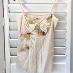 Beautifully Embellished Prada Top! Only Worn Twice. All Beading, Straps And Side Zipper Are In Excellent Condition. White Floral Embellished Tops For Summer, Embellished Cream Top For Summer, Prada Top, Spaghetti Strap Top, Strap Top, Cream White, Side Zipper, Spaghetti Strap, Beading