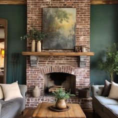 a living room filled with furniture and a fire place in front of a painting on the wall