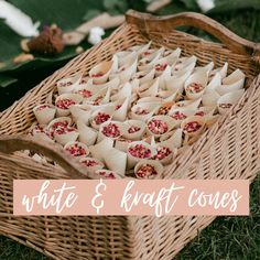 a wicker basket filled with white and red desserts