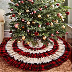 a christmas tree with red, white and gold ornaments