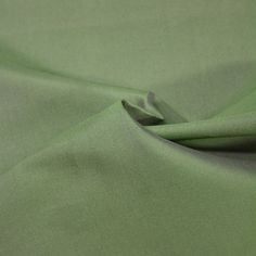 a close up view of a green fabric