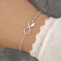 Our elegant Silver Infinity Heart Bracelet is made from 925 sterling silver and features a silver infinity heart charm. Your infinity bracelet will arrive carefully packaged and presented in a Silver Willow gift box, making it a perfect gift for a loved one or a special treat for yourself. Details: * Adjustable bracelet length 18cm, 19cm and 20cm * The bracelet is handmade from 925 sterling silver * The infinity charm measures approx. 7mm x 16mm Shop our Infinity Bracelet Collection: https://www.etsy.com/uk/shop/SilverWillowUk?search_query=infinity+bracelet Thank you for looking! Silver Infinity Bracelets, Couple Ring Design, Latest Bracelets, Pretty Jewelry Necklaces, Infinity Charm, Silver Bracelets For Women, Bracelet Friendship, Infinity Heart, Hand Bracelet