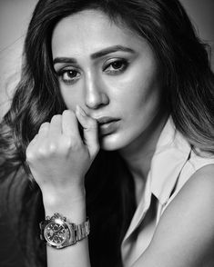 black and white photograph of a woman wearing a watch