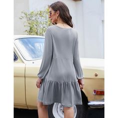 Indulge in comfort and style with our babydoll dress crafted from a blend of 60% cotton, 35% polyester, and 5% spandex. This soft and comfortable dress is the perfect thickness for transitioning from fall to spring, maintaining its shape even after repeated washings. The casual style features a loose fit, ruffle tiered design, puff long sleeves, and a flowy swing silhouette, making it ideal for various occasions. Whether worn as a pleated babydoll dress or as maternity wear, this versatile piece Dresses Long Sleeve Casual, Pleated Tiered Dress, Shift Dress Casual, Tiered Dresses, Grey Style, Tiered Ruffle Dress, Baby Doll Dress, Layered Dress, Elegant Pattern