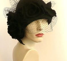 "Black veil hat,Cloche Felted Hat, felt hat, Cloche Hat, black Hat, Art Hat Black Hat La belle epoque Art Deco 1920s hat Art Hats Black hat cloche 1920's hat black roses Hats&Caps Accessories Handmade Great, very flattering black hat with black veil! Adapts to the head ! Special and unique ! Sophisticated and elegant ! I can make this hat in other colors and sizes. Made just for you To measure your head: Using a tape measure, go around head about 1\" above eyebrows in front and include the l Black Gatsby Style Hats For Evening, Black Hats For Winter Races, Black Winter Hats For Races, Winter Black Hats For Races, Black Fedora Felt Hat For Evening, Elegant Black Felt Hat For Kentucky Derby, Elegant Black Felt Hat For Evening, Black Winter Wedding Fascinator, Black Wedding Hat For Winter