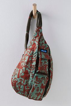 a handbag hanging from a hook on a wall